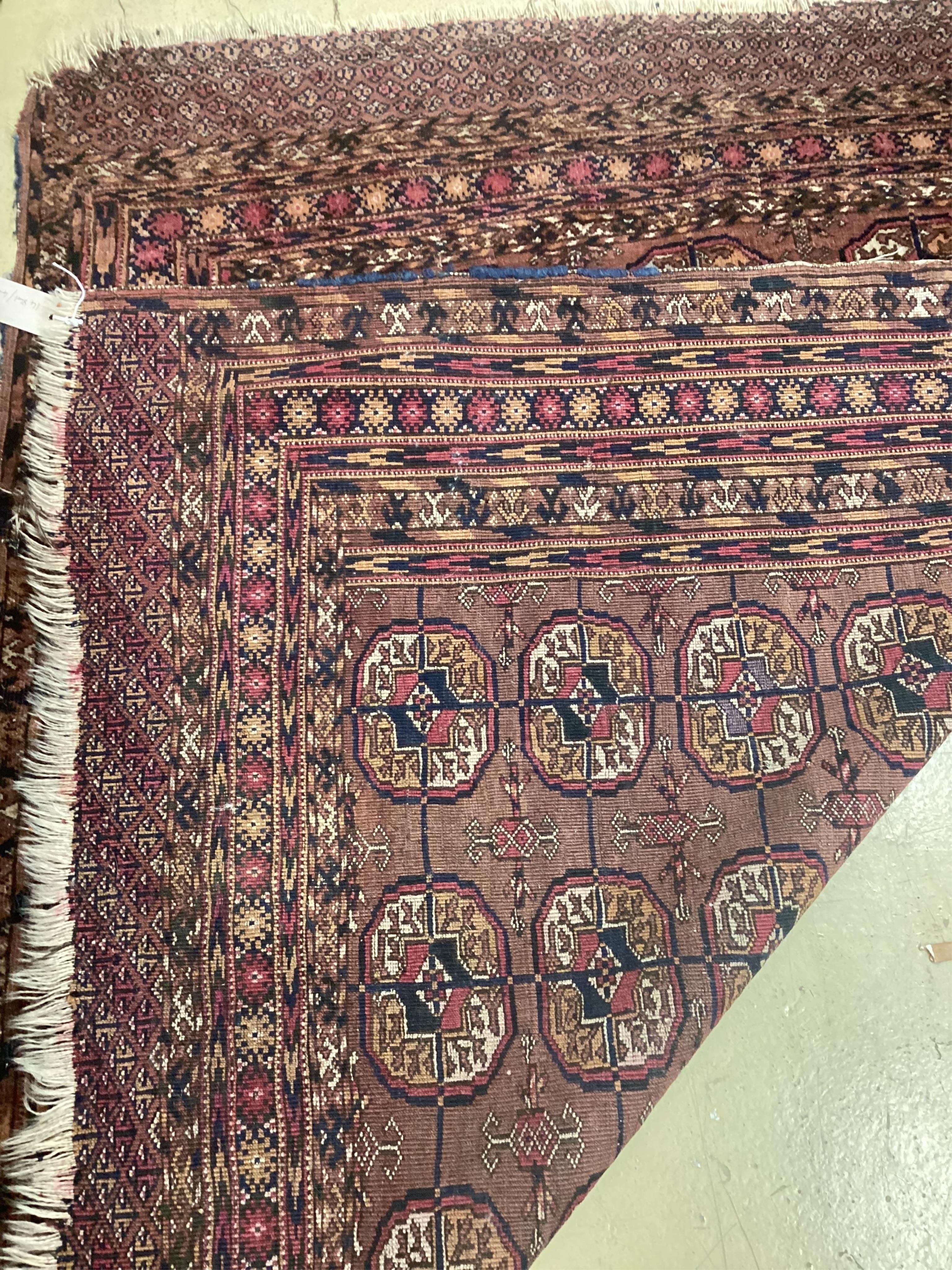 A Tekke plum ground rug, 130 x 110cm. Condition - fair